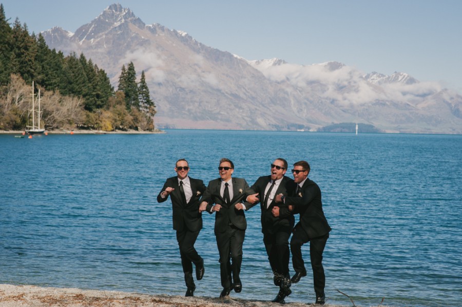 Groomsmen strutting with Lake Wakatipu in the background