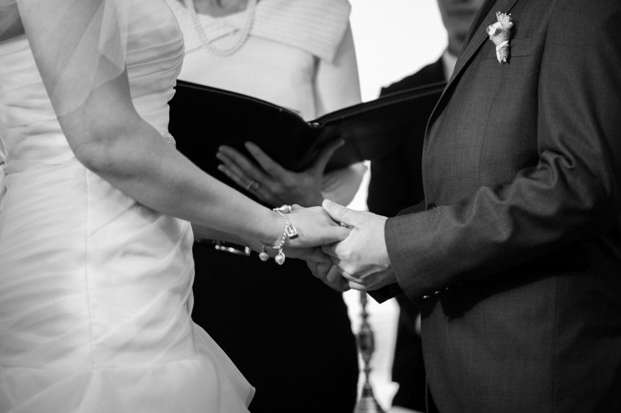 Nathan and Talitha holding hands during the ceremony
