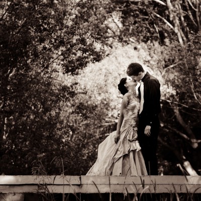 Bride and Groom on a bridge at Amore Gardens, Currumbin