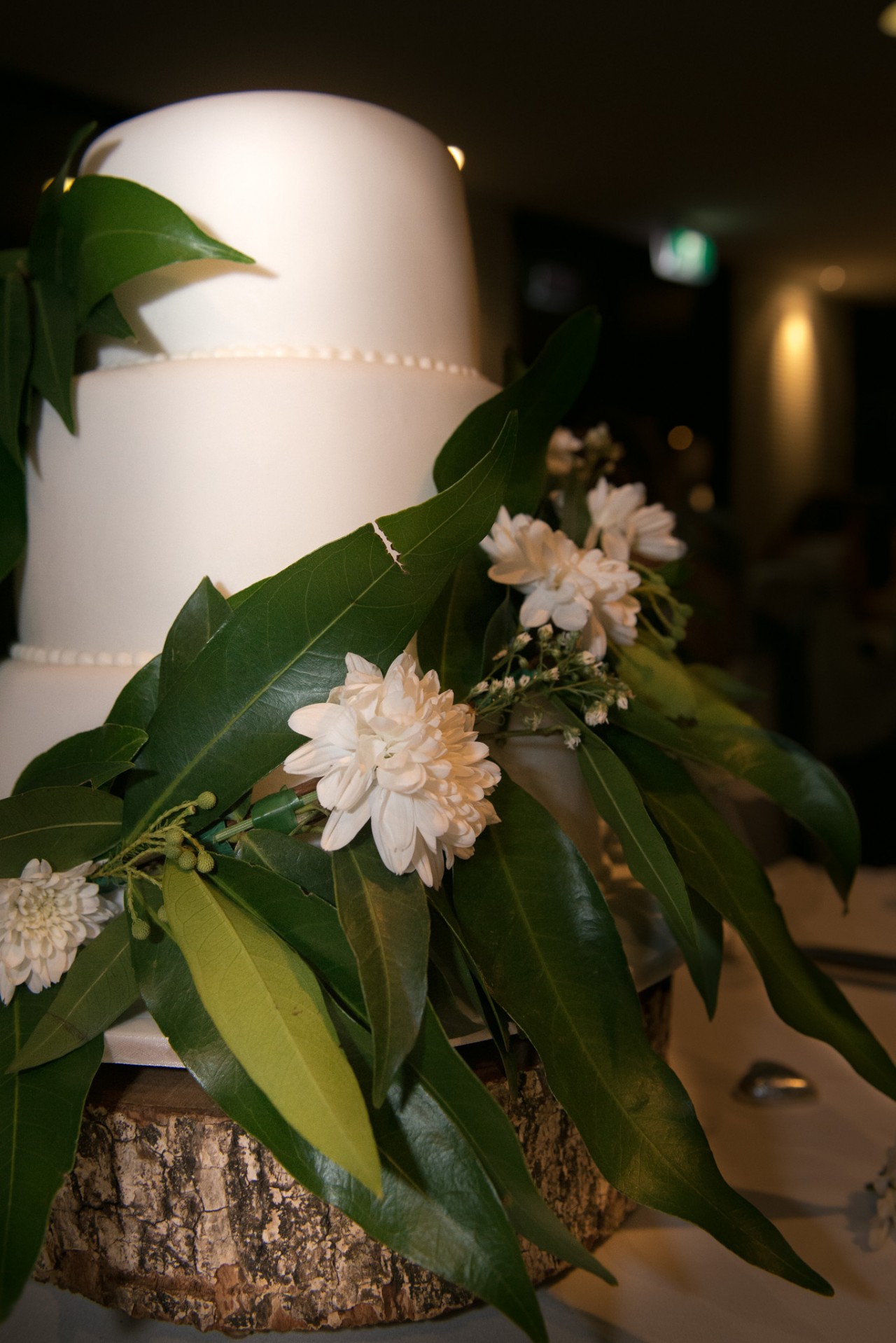 Wedding cake decorated with themed flowers