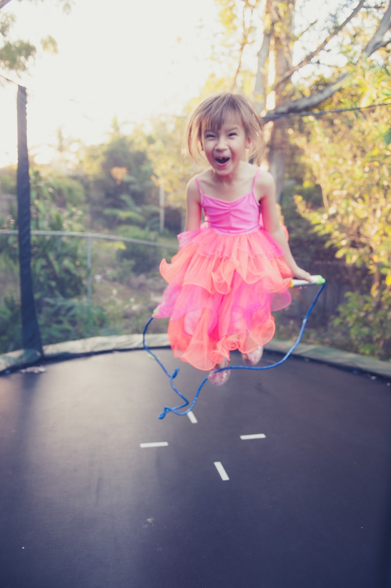 Olivia having a play on the trampoline