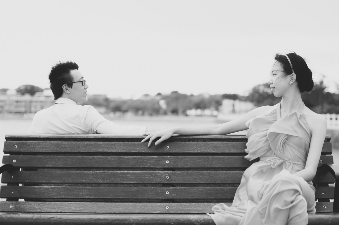 Wynnum Esplanade Portraits - Engagement Photos by MinWye Studios - Jun looking over at Tish on a bench