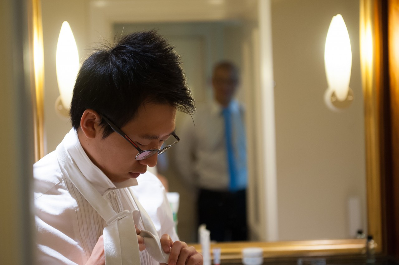 Jun preparing his tie at the Marriott Brisbane