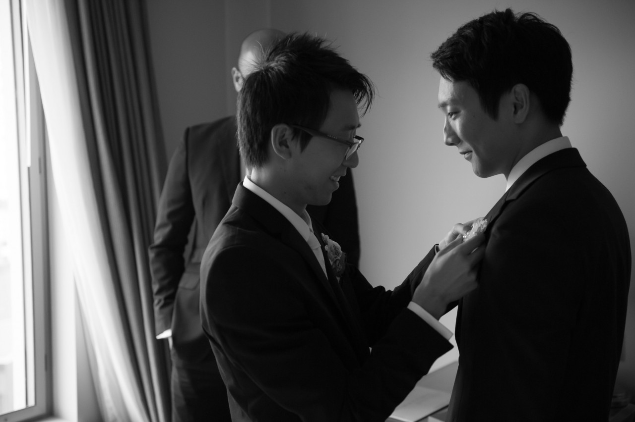 Jun helping Alex with his corsage