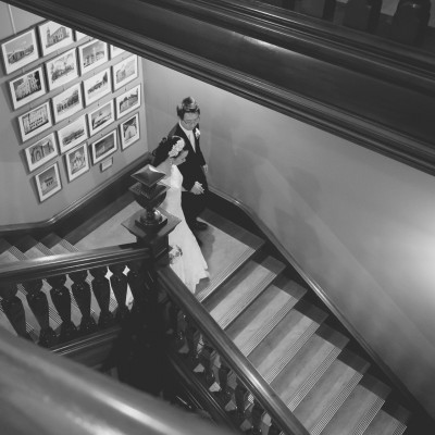 Brisbane Customs House Wedding: Tish and Jun walking down the stairs for their wedding reception