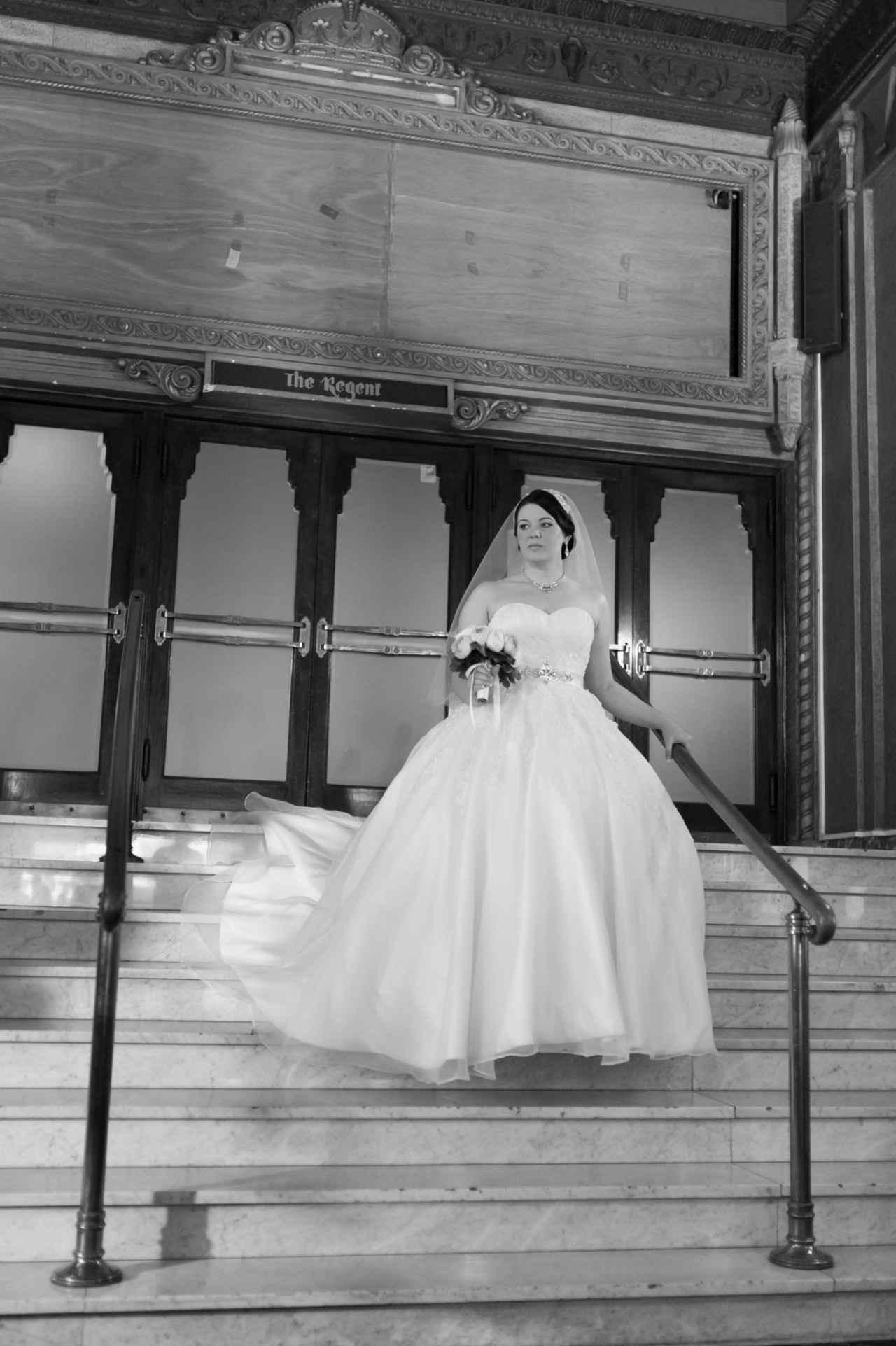 Melissa the bride walking down the stair in the Regents Theatre