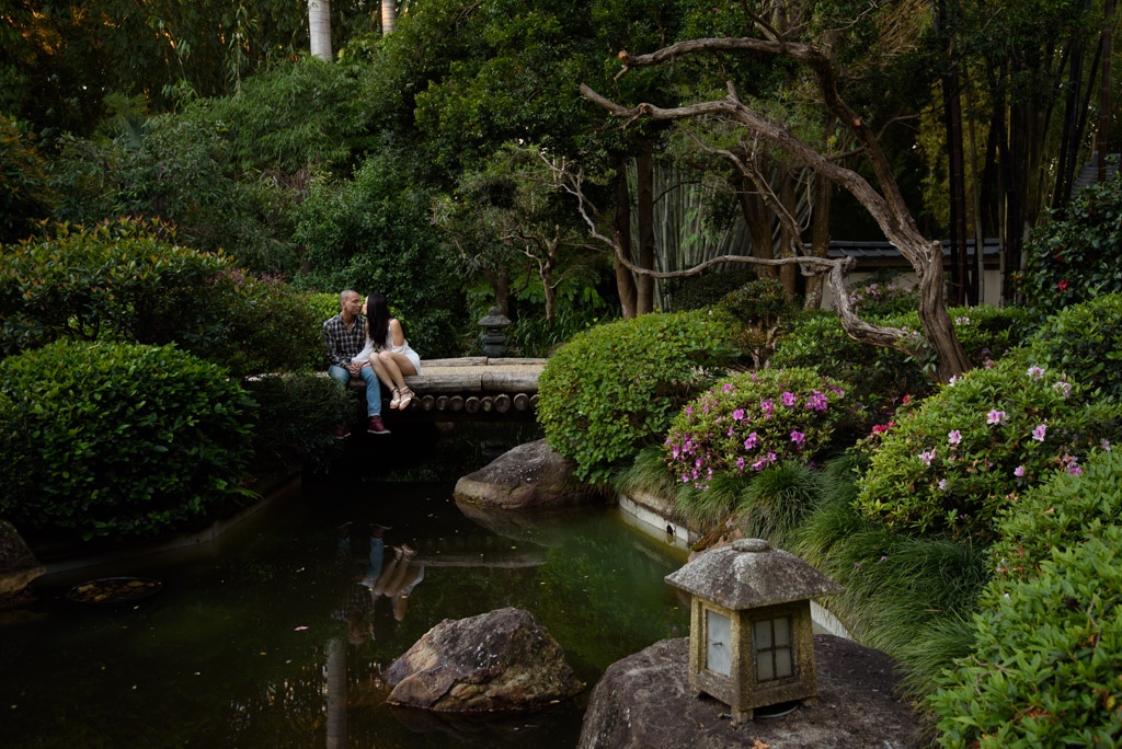 Jason and Jessica sitting on a bridge in the Mt Coot-Tha Botanic Gardens, Japanese Gardens