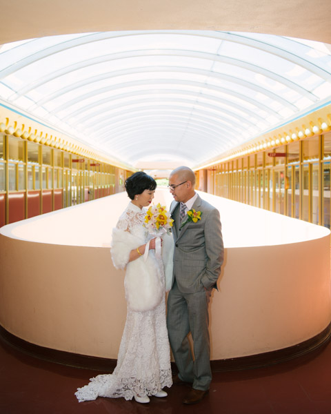 Bride and groom under the Marin County Civic Center Symmetry