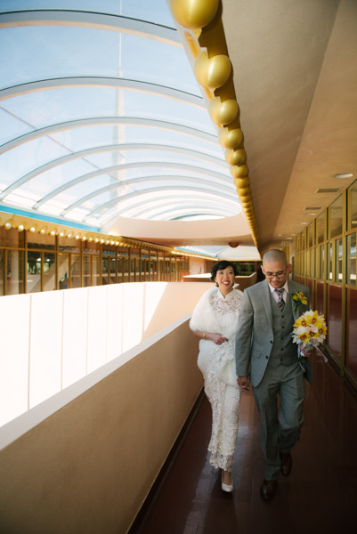 Bride and groom walking the through the Marin County Civic Center Symmetry