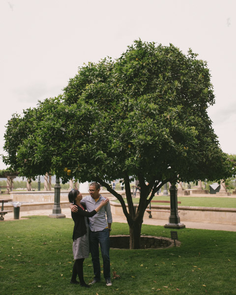 Maurice and Maggie standing under a hybrid lemon orange tree at Inglenook Estate, Napa Valley