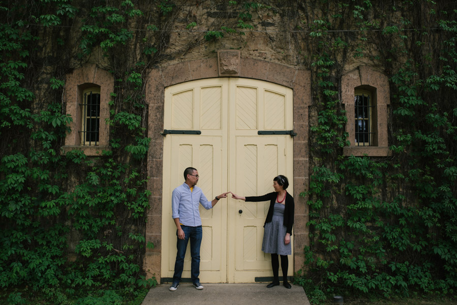 Maurice and Maggie touching fingers in front of a Napa Valley gate
