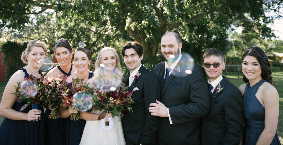 Bridal party with bubbles at New Farm