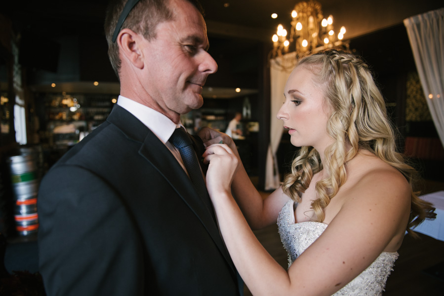 Charlotte putting on her father's boutonniere