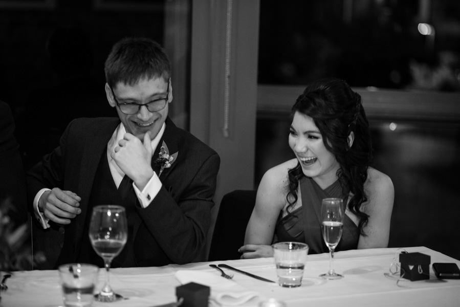 Groomsman and groomslady laughing at speeches