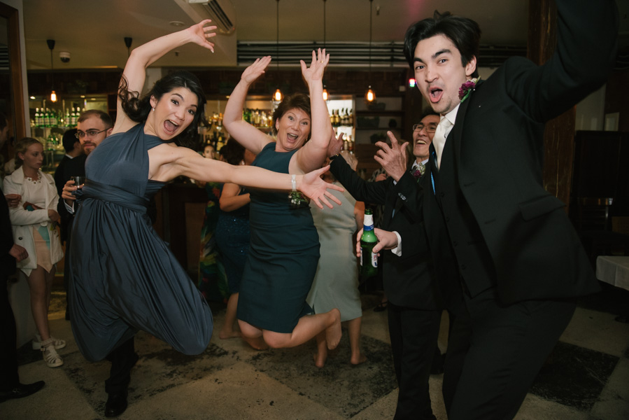 Groom and family jump shot